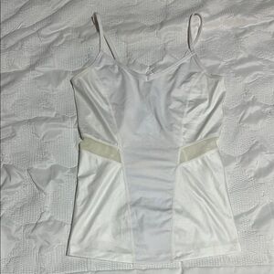 White Fabletics tank with mesh details